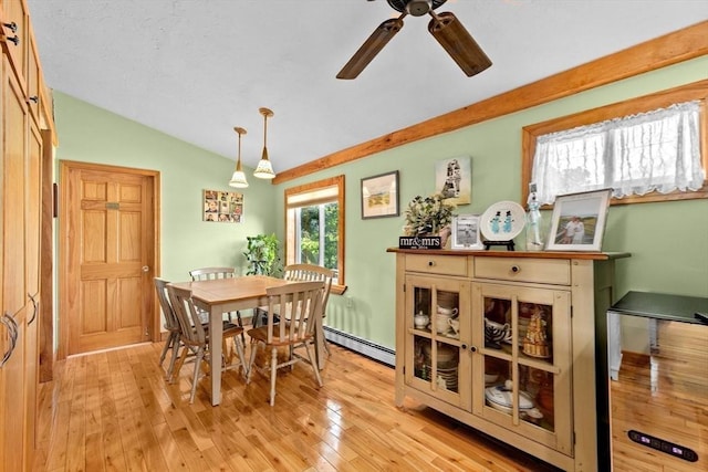 13 Elcott Rd, Quincy, MA 02169 - dining space featuring ceiling fan, light wood-type flooring, lofted ceiling, and a baseboard radiator