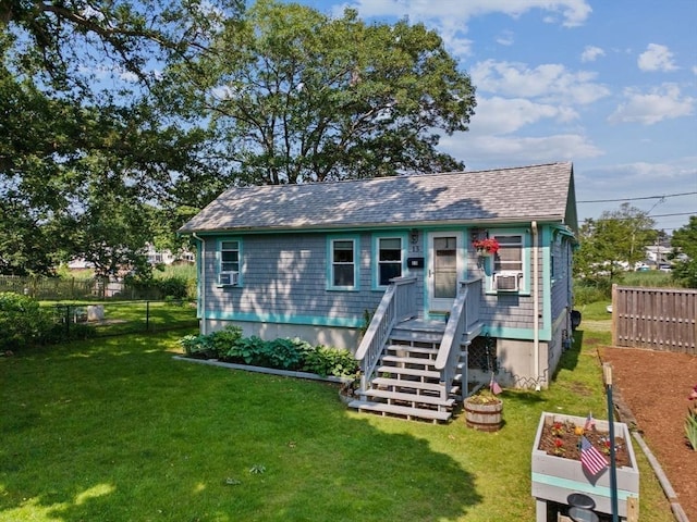 13 Elcott Rd, Quincy, MA 02169 - back of house featuring a garden, a shingled roof, and cooling unit