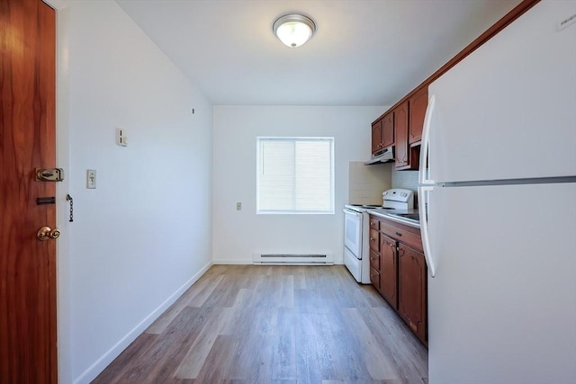 kitchen featuring a baseboard heating unit, tasteful backsplash, white appliances, light wood-style floors, and baseboards