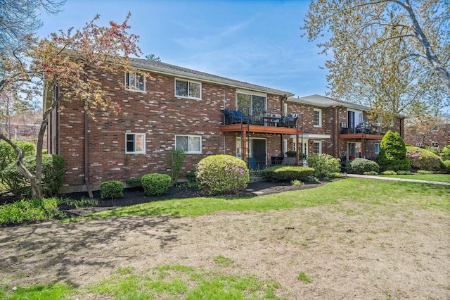 79 Fountain Unit 5, Weymouth, MA 02190 - back of house with a lawn, brick siding, and a balcony