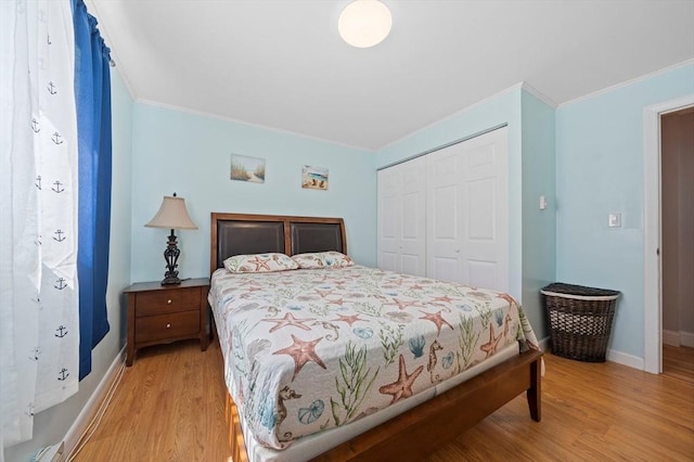 79 Fountain Unit 5, Weymouth, MA 02190 - bedroom featuring baseboards, ornamental molding, light wood finished floors, and a closet
