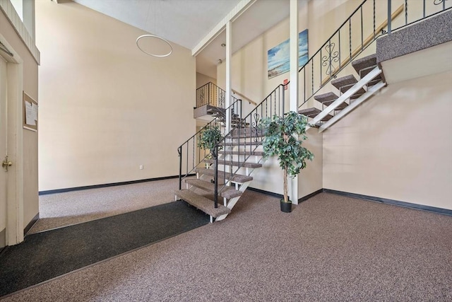 79 Fountain Unit 5, Weymouth, MA 02190 - stairway featuring baseboards, carpet flooring, and a towering ceiling