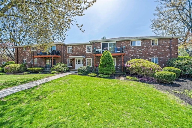 79 Fountain Unit 5, Weymouth, MA 02190 - townhome / multi-family property featuring a front lawn, brick siding, and a balcony