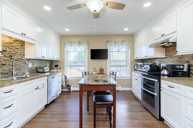 191 Providence St, Putnam, CT 06260 - kitchen with stainless steel appliances, healthy amount of natural light, under cabinet range hood, decorative backsplash, and recessed lighting