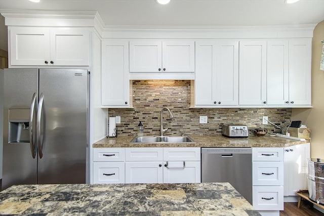 191 Providence St, Putnam, CT 06260 - kitchen with appliances with stainless steel finishes, white cabinets, decorative backsplash, and crown molding