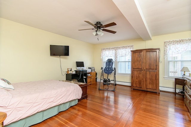 bedroom with hardwood / wood-style flooring, ceiling fan, beamed ceiling, and multiple windows