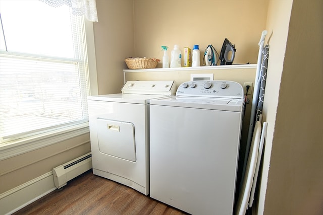 laundry room featuring separate washer and dryer, dark hardwood / wood-style floors, and a baseboard heating unit