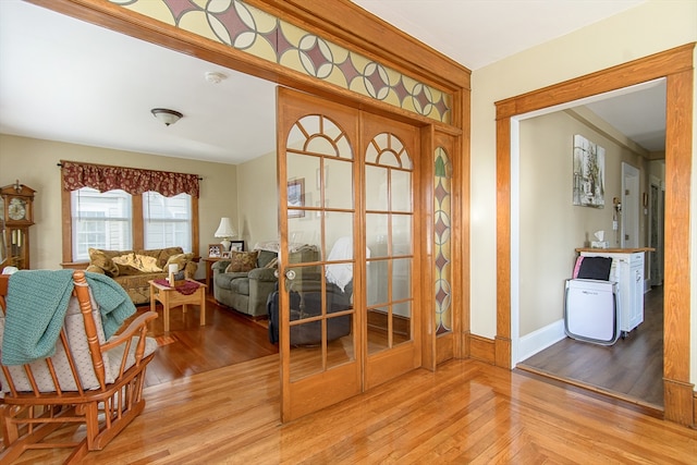 foyer entrance with light hardwood / wood-style floors