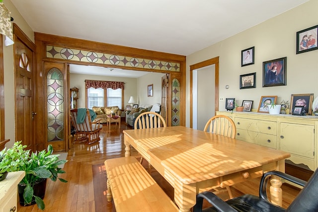 dining space featuring wood-type flooring