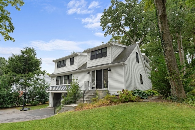 view of front of home with a garage and a front yard