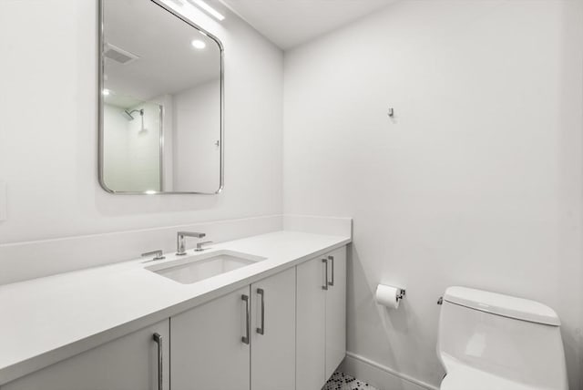 2 Clarendon St Unit 510, Boston, MA 02116 - bathroom with vanity, toilet, and baseboards