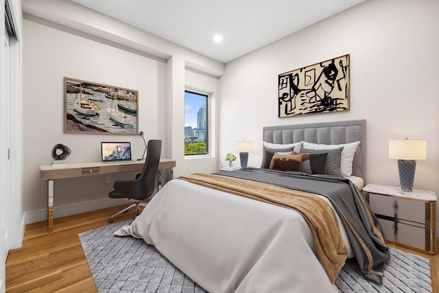 2 Clarendon St Unit 510, Boston, MA 02116 - bedroom featuring wood finished floors, baseboards, recessed lighting, and a desk