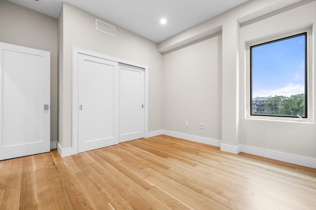 2 Clarendon St Unit 510, Boston, MA 02116 - unfurnished bedroom with light wood finished floors, baseboards, a closet, and recessed lighting