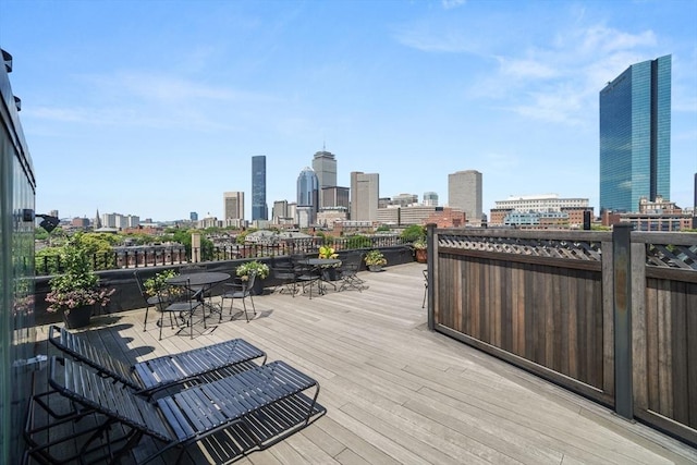 2 Clarendon St Unit 510, Boston, MA 02116 - wooden deck with a skyline view and outdoor dining area