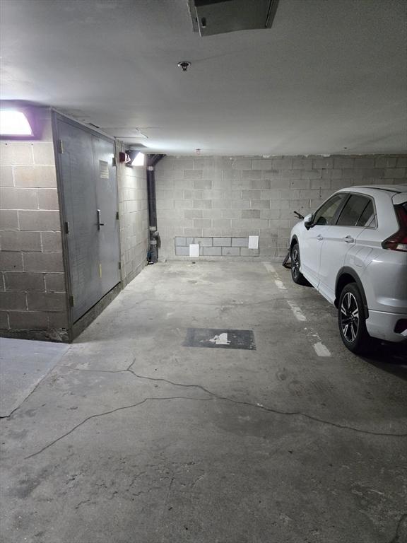 2 Clarendon St Unit 510, Boston, MA 02116 - garage featuring concrete block wall
