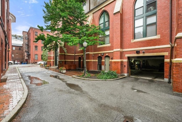 2 Clarendon St Unit 510, Boston, MA 02116 - view of building exterior featuring a garage and driveway
