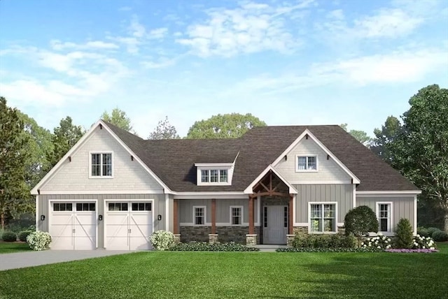 view of front of home with a garage and a front lawn