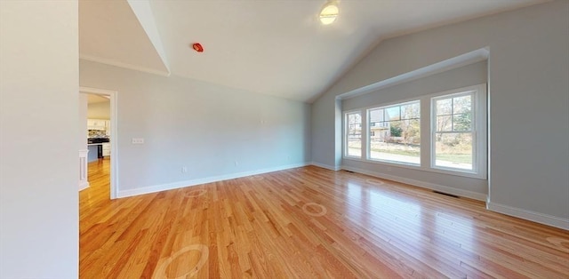 interior space with vaulted ceiling and light hardwood / wood-style floors