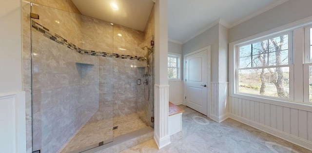 bathroom with ornamental molding and walk in shower