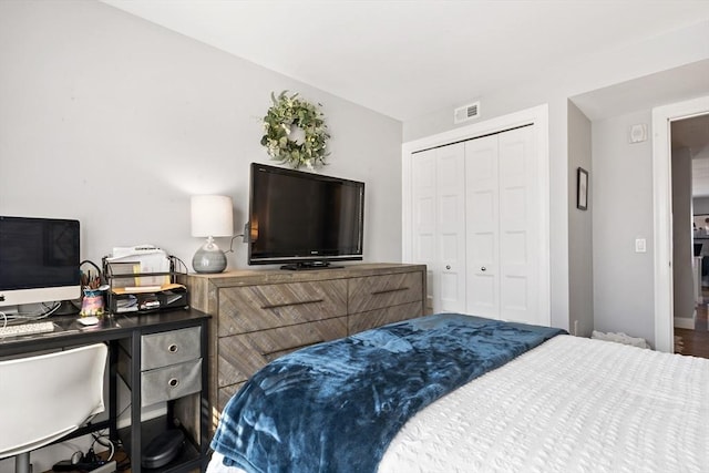 bedroom featuring a closet and visible vents