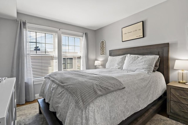 bedroom with wood finished floors