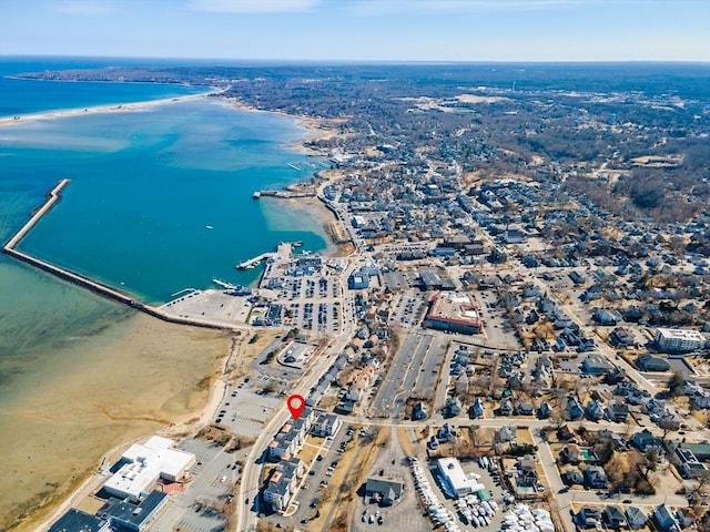 aerial view with a water view and a beach view