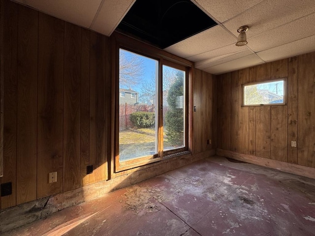 interior space featuring wooden walls