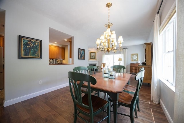 140 Commonwealth Ave Unit 38, North Attleboro, MA 02763 - dining room with baseboards, a chandelier, and dark wood-style floors