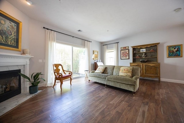 140 Commonwealth Ave Unit 38, North Attleboro, MA 02763 - living room with a premium fireplace, dark wood finished floors, and baseboards
