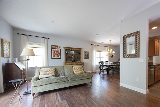 140 Commonwealth Ave Unit 38, North Attleboro, MA 02763 - living room featuring a chandelier, dark wood-style floors, and baseboards