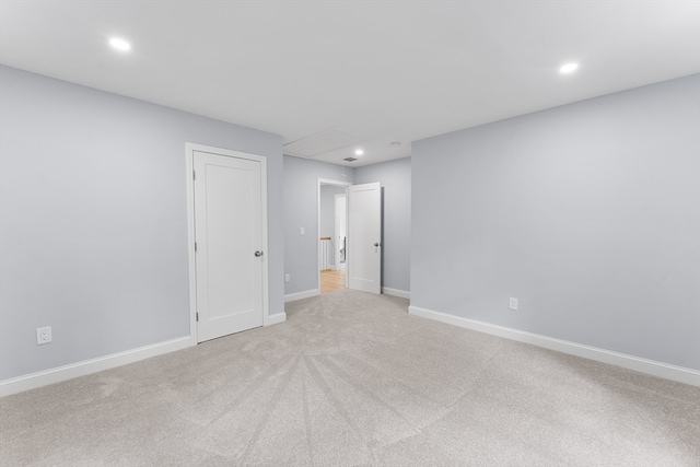 unfurnished bedroom with light colored carpet