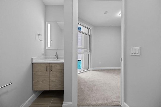 bathroom featuring vanity and baseboards