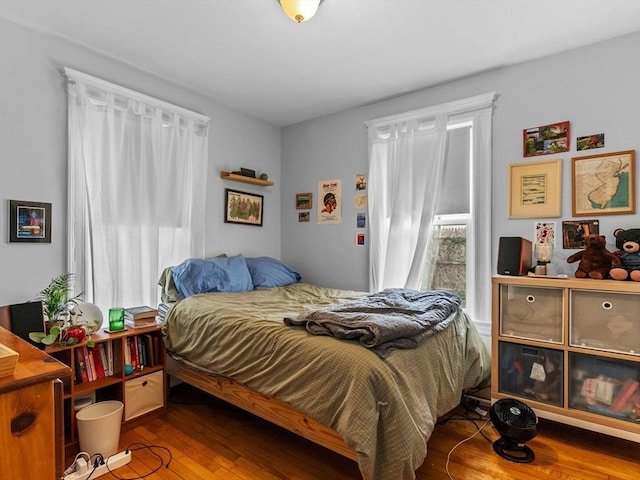 bedroom with wood finished floors