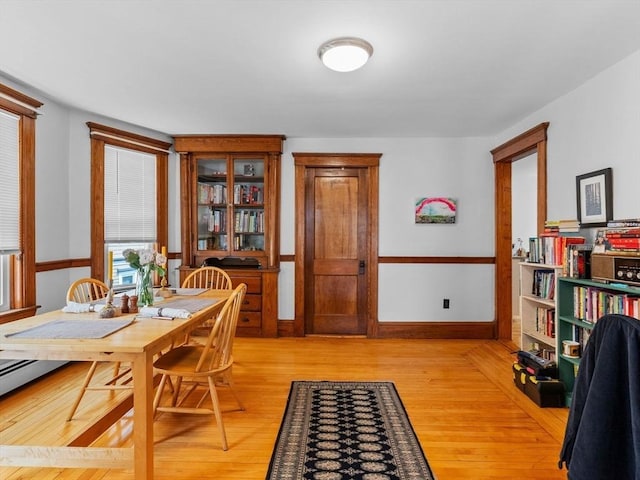 dining area with light wood finished floors