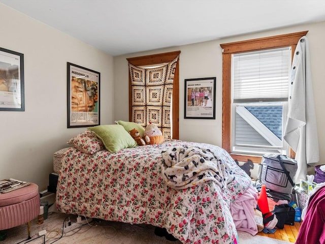 bedroom featuring wood finished floors
