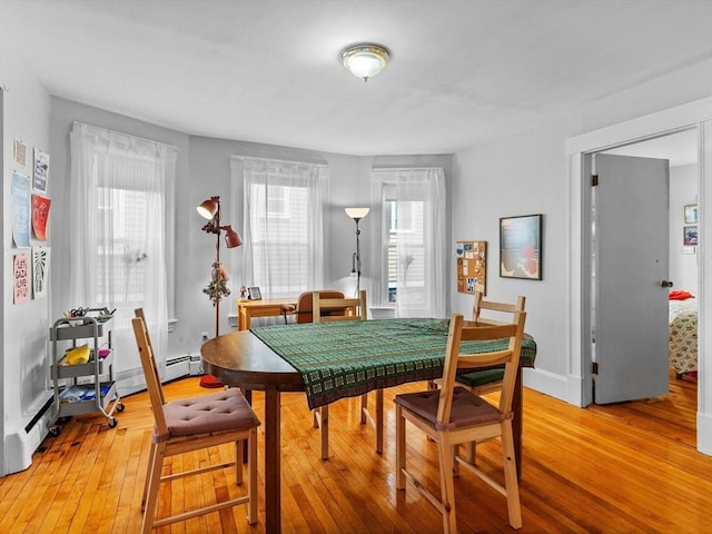 dining area with light wood finished floors