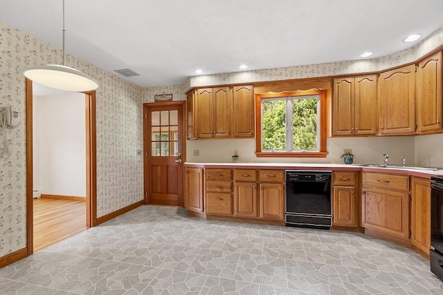 15 Greenbrook Rd, Hamilton, MA 01982 - kitchen with black dishwasher, stone floors, wallpapered walls, light countertops, and brown cabinets