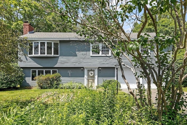 15 Greenbrook Rd, Hamilton, MA 01982 - view of front of property with a chimney, a garage, and roof with shingles