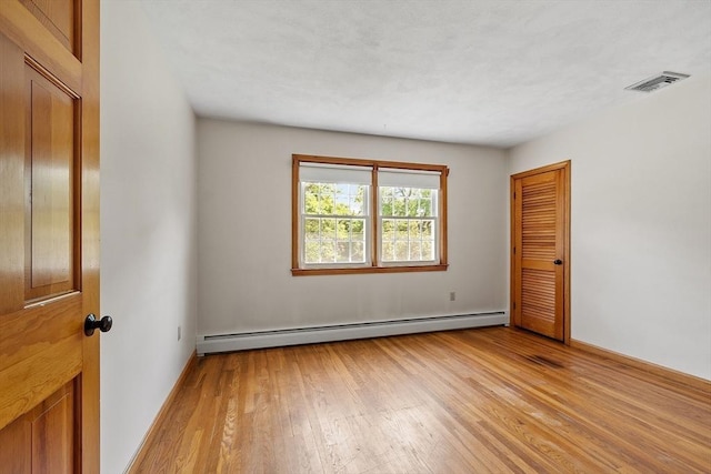 15 Greenbrook Rd, Hamilton, MA 01982 - unfurnished room with a baseboard radiator and light wood-style floors