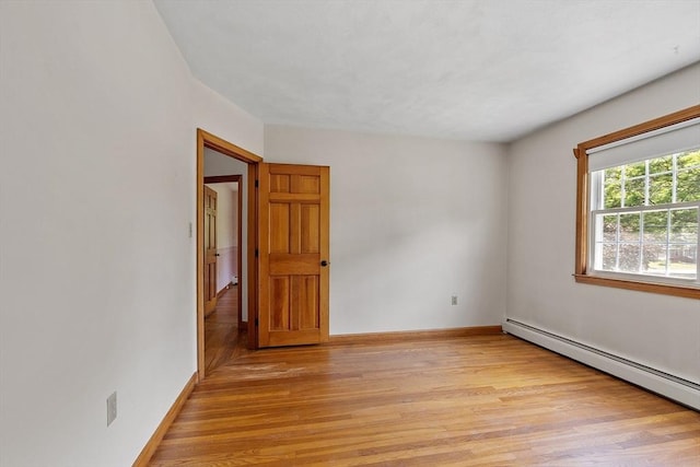 15 Greenbrook Rd, Hamilton, MA 01982 - unfurnished room featuring a baseboard heating unit and light wood finished floors
