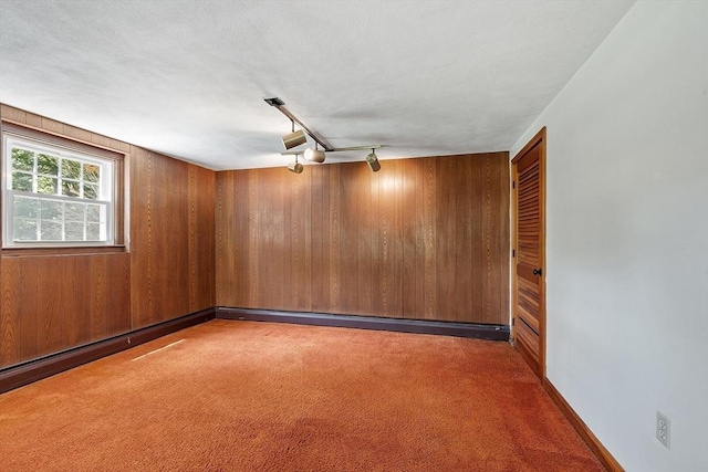 15 Greenbrook Rd, Hamilton, MA 01982 - empty room with carpet floors and wood walls
