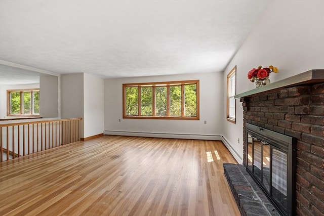 15 Greenbrook Rd, Hamilton, MA 01982 - unfurnished living room featuring baseboard heating, a brick fireplace, wood finished floors, and a baseboard heating unit