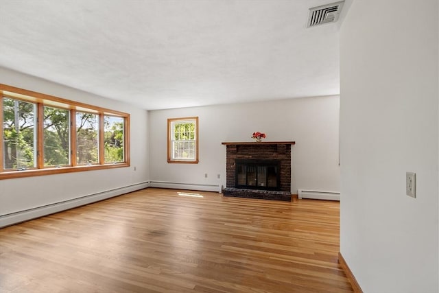15 Greenbrook Rd, Hamilton, MA 01982 - unfurnished living room featuring a baseboard radiator, wood finished floors, and a brick fireplace