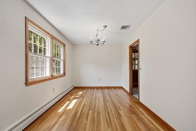 15 Greenbrook Rd, Hamilton, MA 01982 - unfurnished room featuring a baseboard heating unit, plenty of natural light, light wood-style flooring, and a chandelier