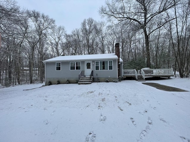 view of front of home with a wooden deck