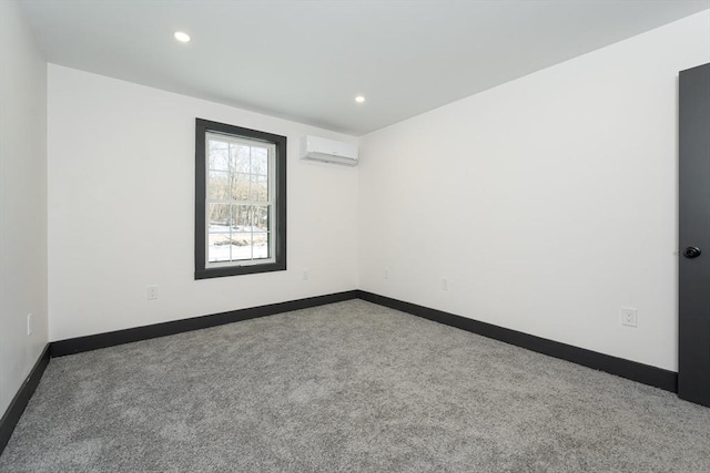 unfurnished room with light colored carpet and a wall mounted air conditioner