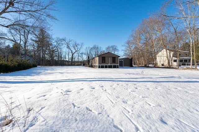 view of yard layered in snow