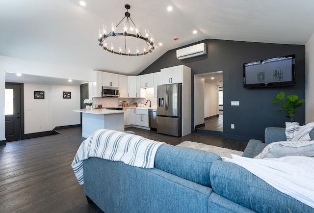 living room with dark wood-type flooring, sink, a wall mounted AC, vaulted ceiling, and plenty of natural light