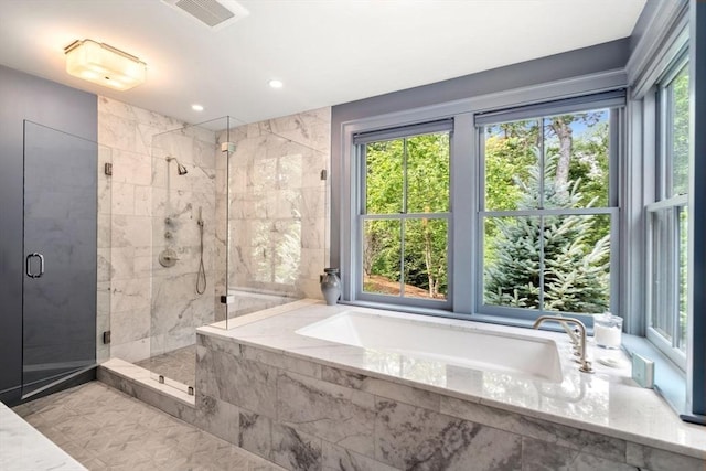 full bathroom with a stall shower, a garden tub, visible vents, and recessed lighting
