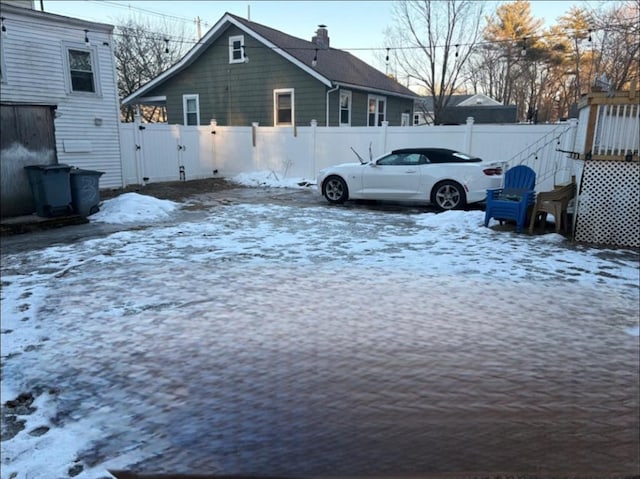 view of yard layered in snow